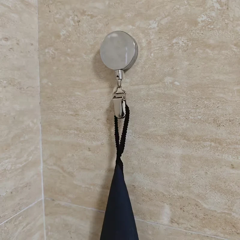 Porte-serviette adhésif rétractable